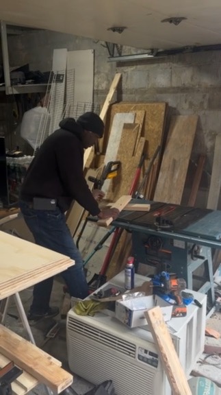 TV Accent Wall with Wooden Slats and Floating Shelf — during