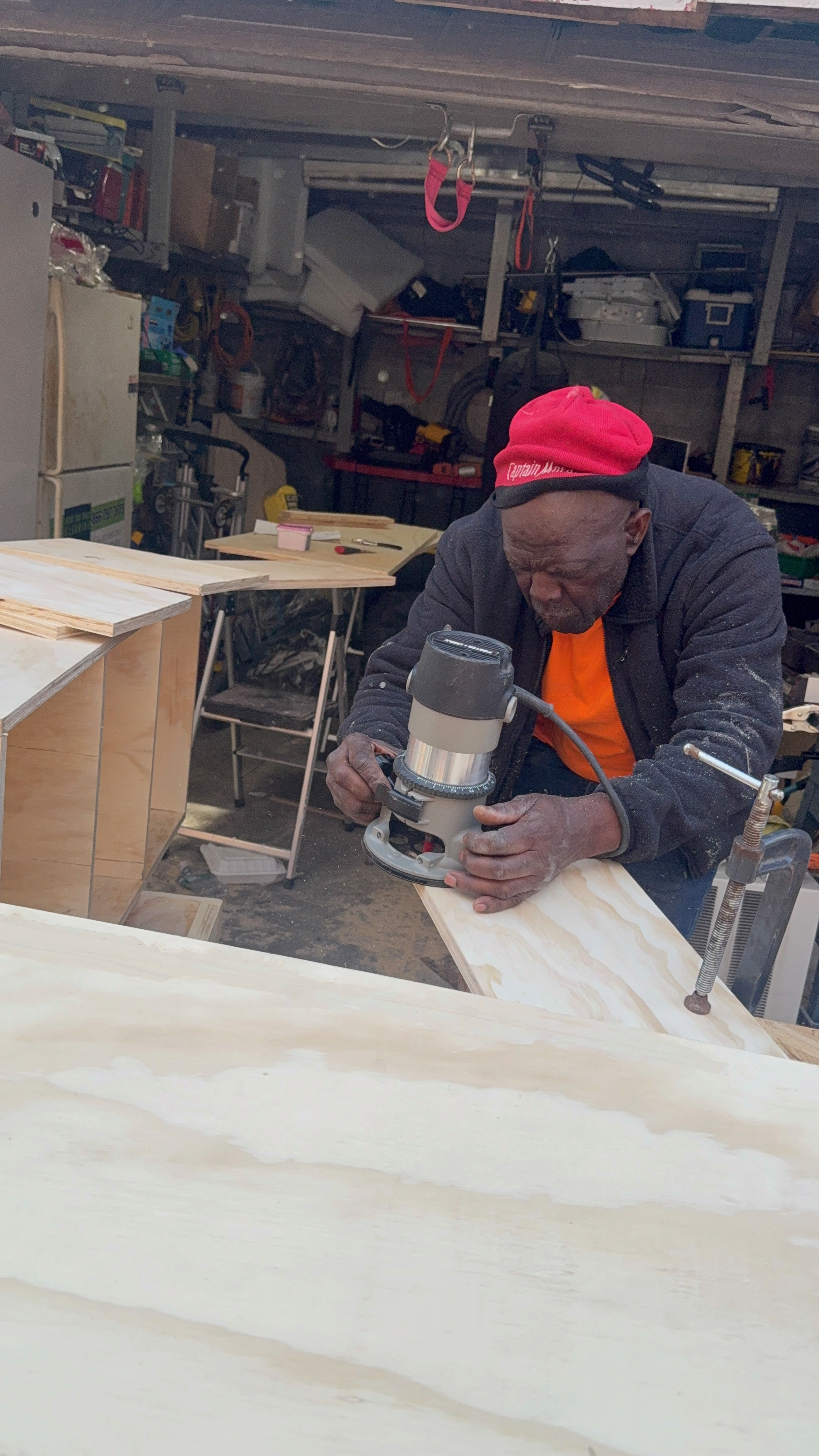 TV Accent Wall with Wooden Slats and Floating Shelf — during