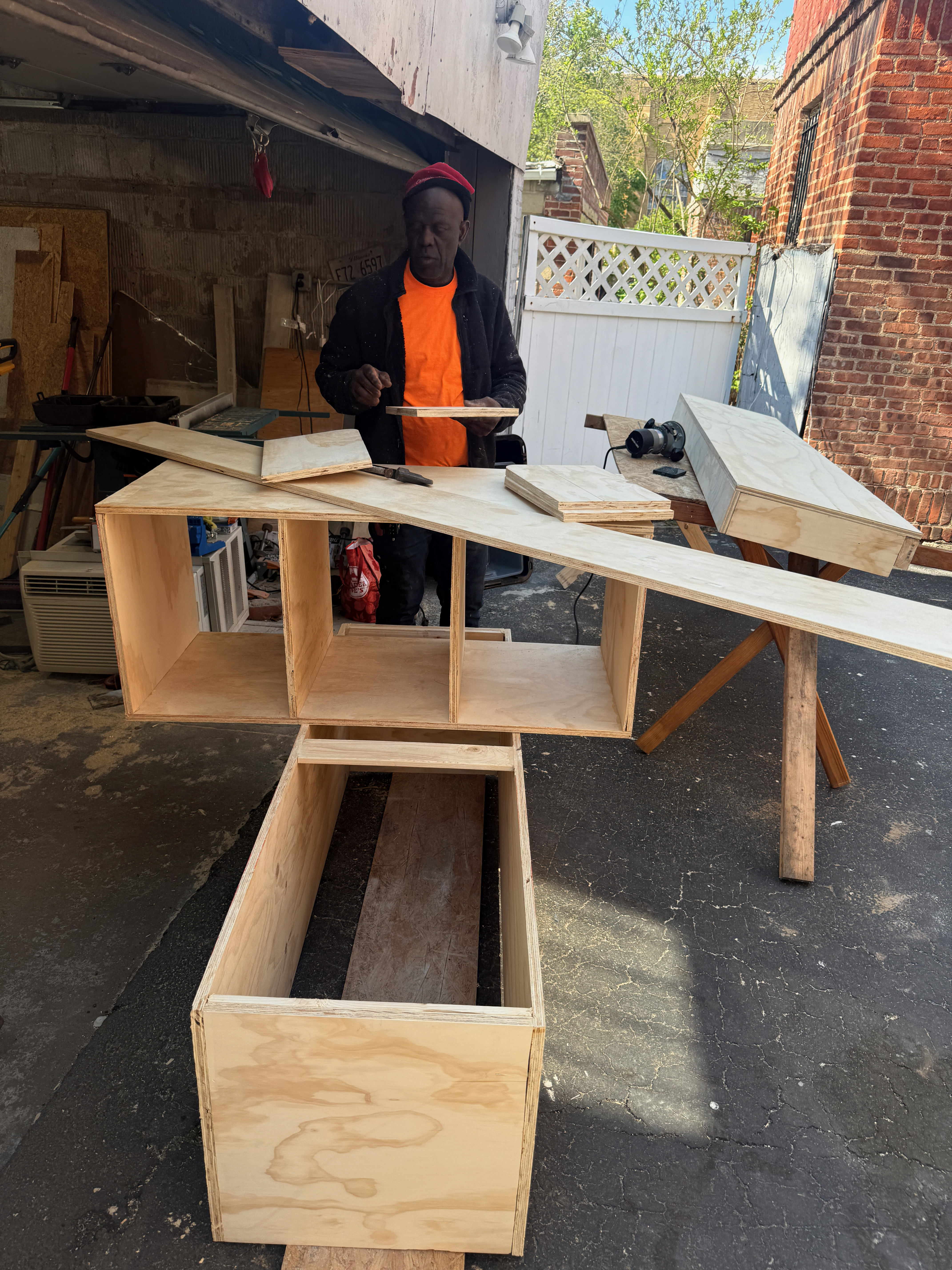 TV Accent Wall with Wooden Slats and Floating Shelf — during