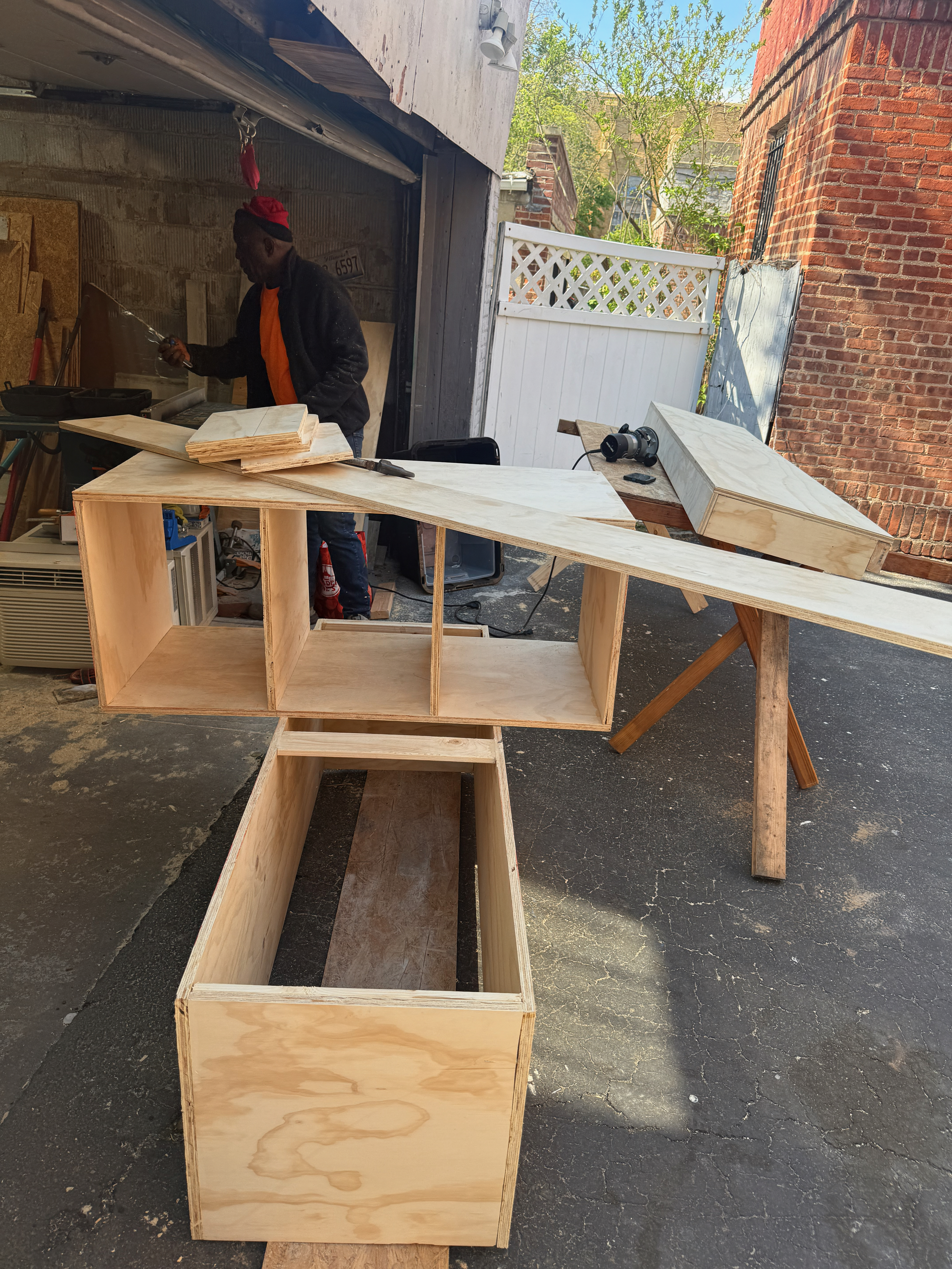 TV Accent Wall with Wooden Slats and Floating Shelf — during