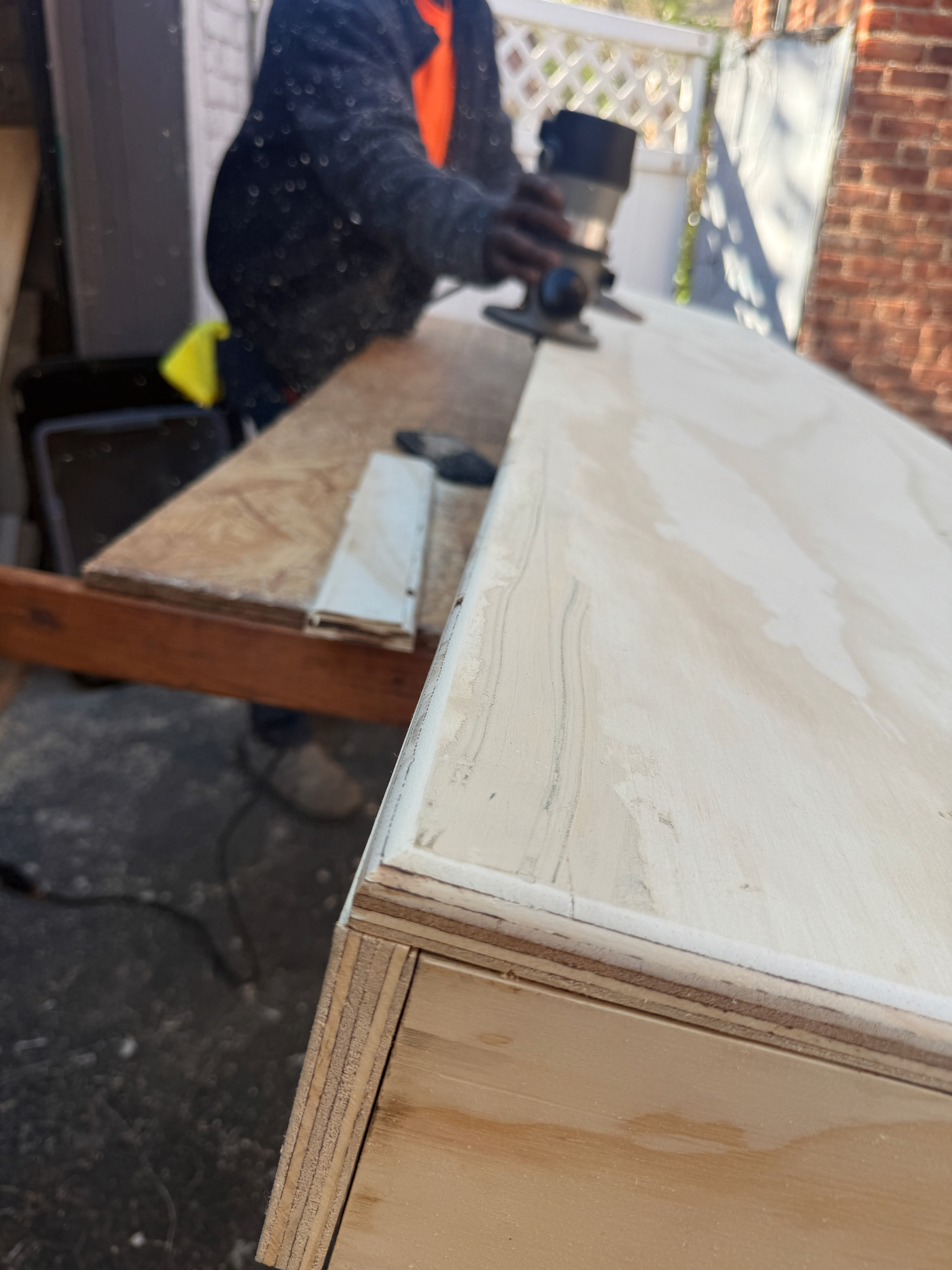 TV Accent Wall with Wooden Slats and Floating Shelf — during