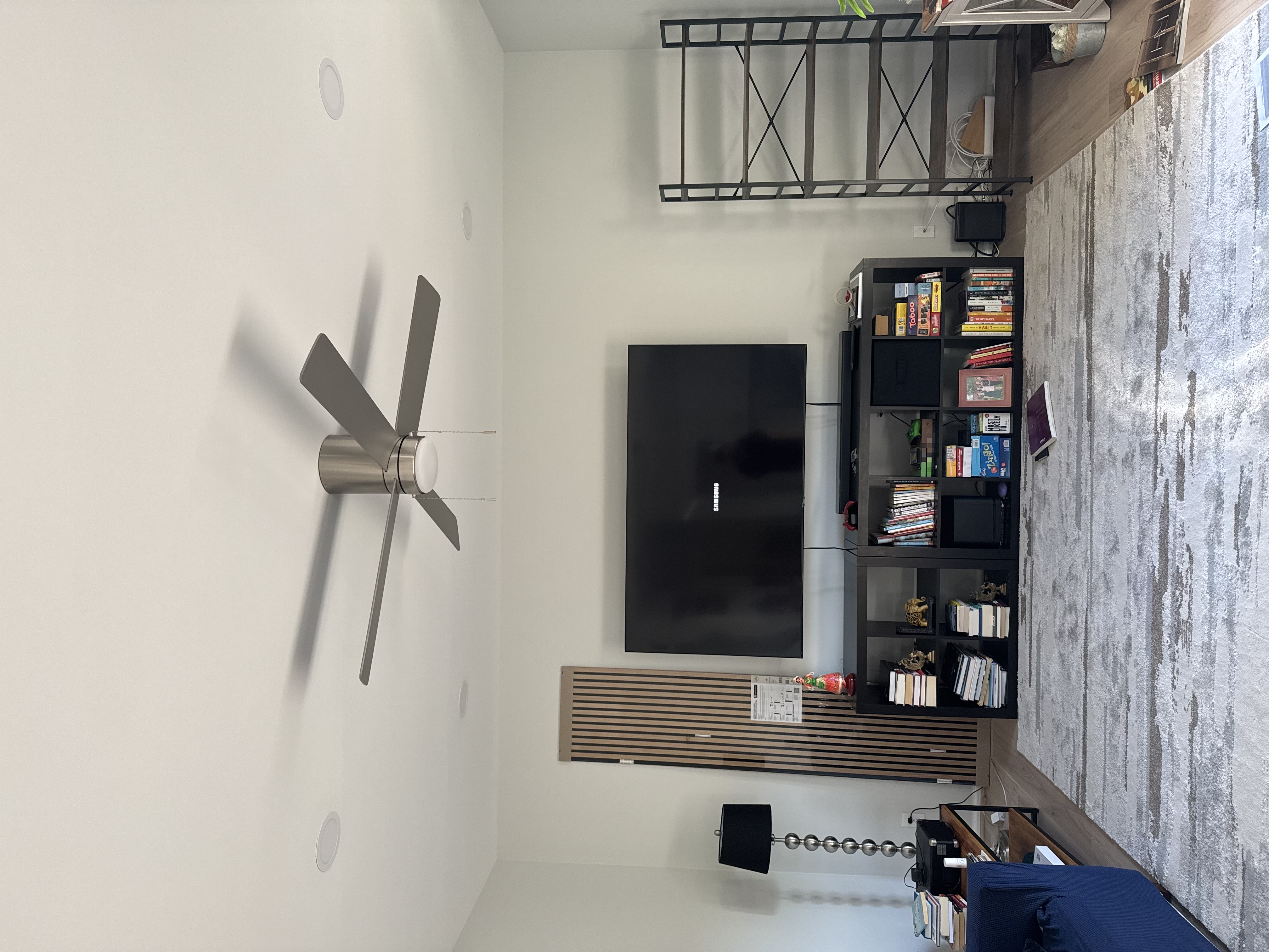 TV Accent Wall with Wooden Slats and Floating Shelf — before
